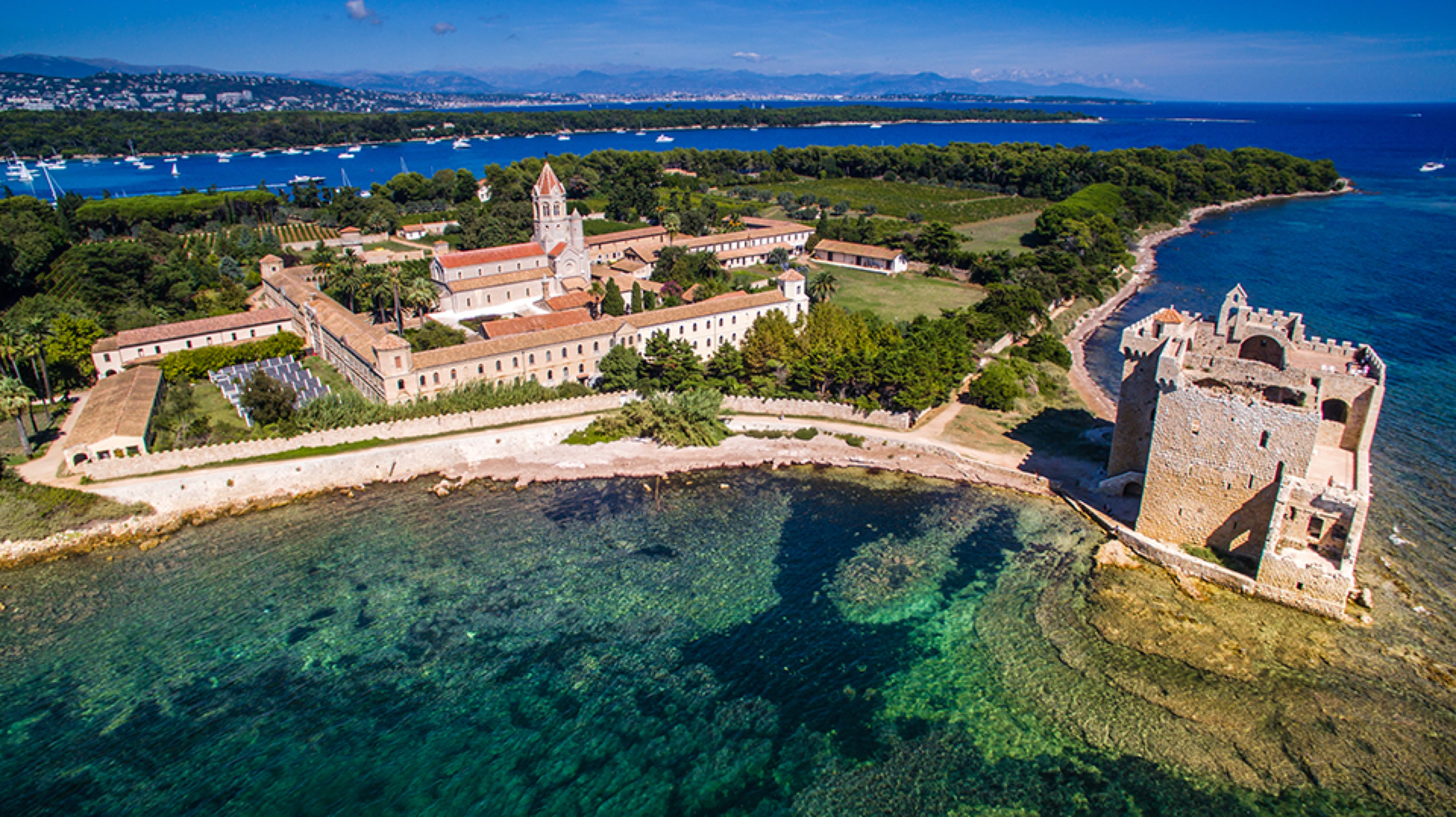 Smaller and imbued with serenity, Saint-Honorat Island is a haven of peace. It is home to a Cistercian abbey over 16 centuries old, where monks still live and produce renowned wines. Visitors can explore ancient chapels, the monastery tower, and savor the unique tranquility of this spiritual site. 