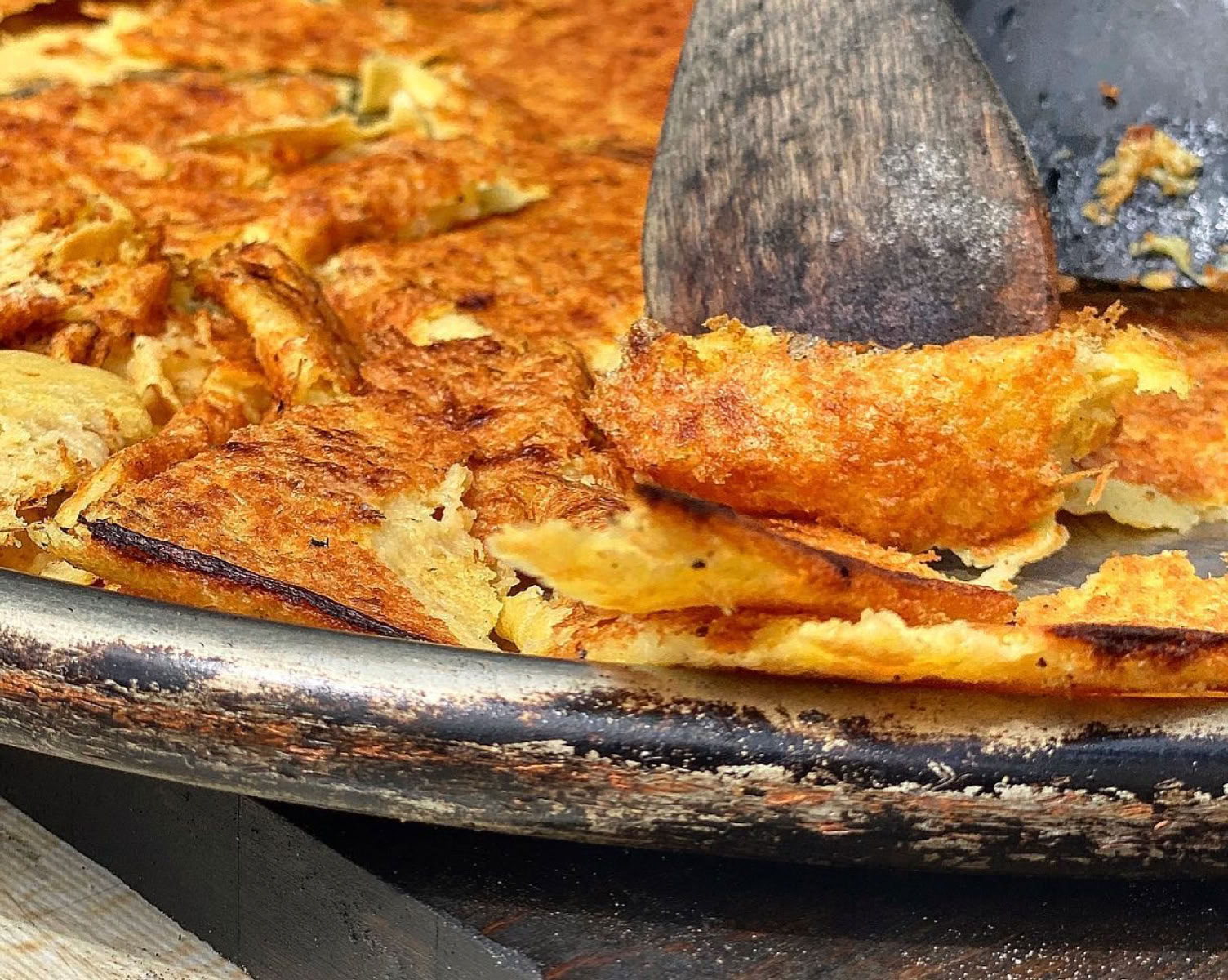 Another Niçoise Treasure! This is a very popular culinary specialty in Nice, but also enjoyed in other parts of the French Riviera. Socca is a type of thin pancake or flatbread made from chickpea flour, water, olive oil, and salt. It's baked in a very hot oven until the edges become crispy while the center remains soft and tender.